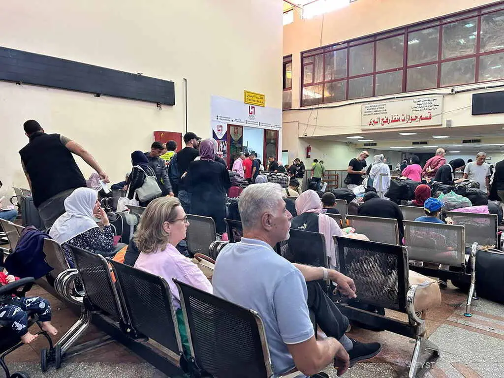 Foreign passport holders wait at Rafah border crossing after evacuations from the Gaza Strip, in Rafah, Egypt, 15 November 2023